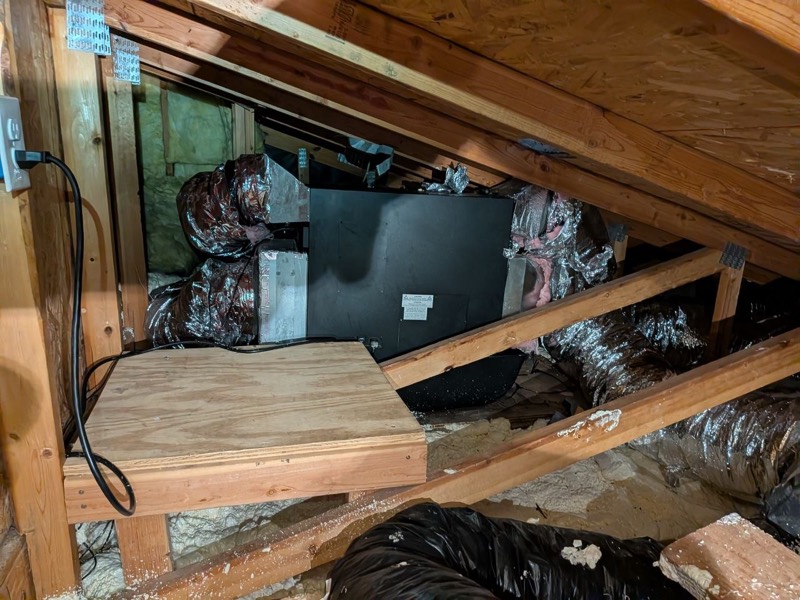 Ducted wine cellar evaporator installed in an attic
